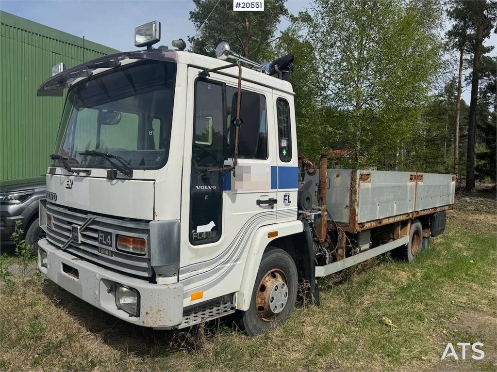 Volvo FL4 Flatbed Truck with HMF Crane – Sold as a Repai 1987 20551 FL4 Flatbed Truck with HMF Crane – Sold as a Repai 198...