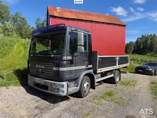 MAN TGL 8.240 4x2 flatbed truck w/ two sets of tires. TGL 8.240 4x2 flatbed truck w/ two sets of tires. 2006 2
